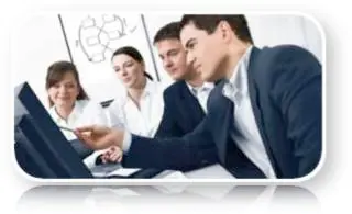 A team of professionals in formal attire discussing data during a business training session, with a presentation screen in the background